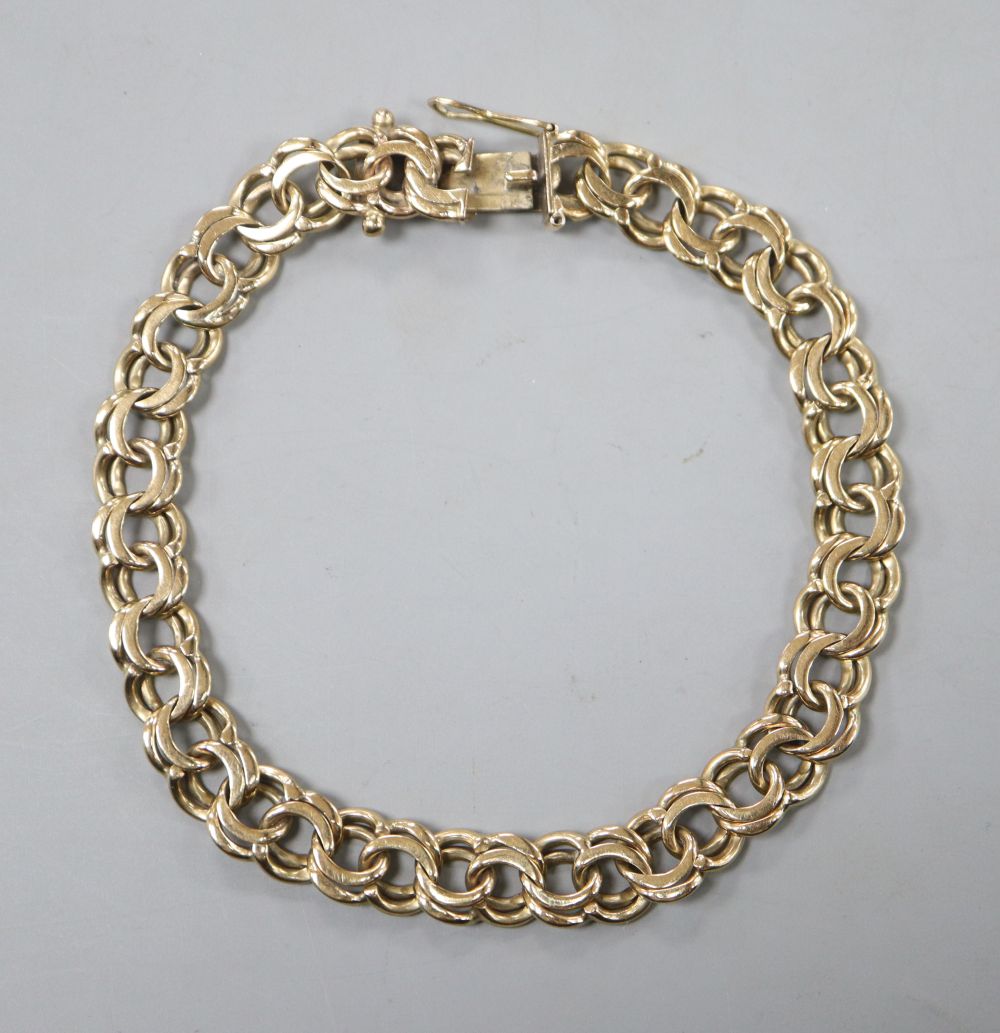 A yellow metal double link bracelet (tests as 9ct gold), 16.5 grams.